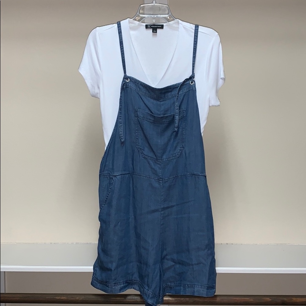 Blue Jean romper and white shirt.